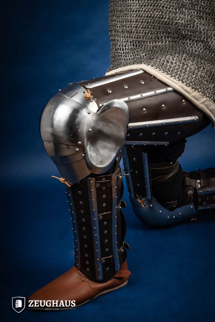 Splinted Leg Armor Brown featuring studded leather and steel strips, designed for historical reenactments and protection during battle.