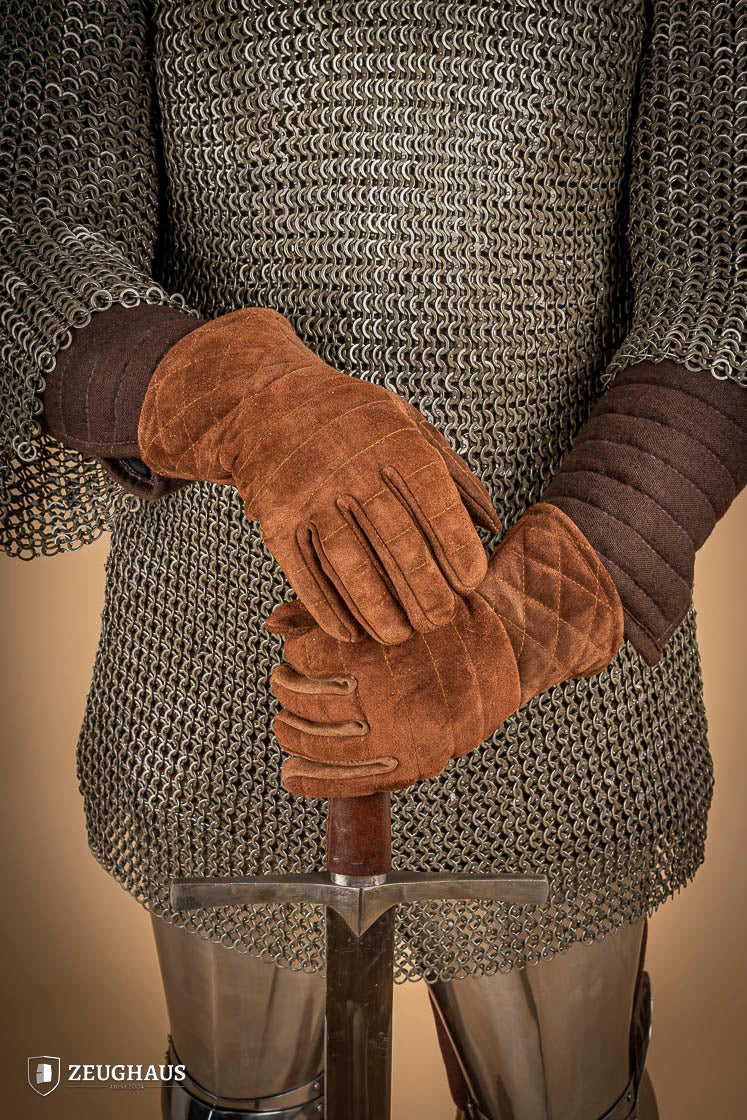 A pair of brown suede gloves designed for gauntlets, showcasing their soft texture and natural leather finish.