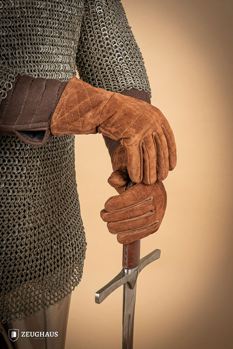 A pair of brown suede gloves designed for gauntlets, showcasing their soft texture and natural leather finish.