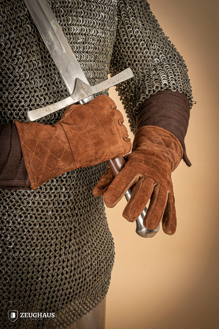 A pair of brown suede gloves designed for gauntlets, showcasing their soft texture and natural leather finish.