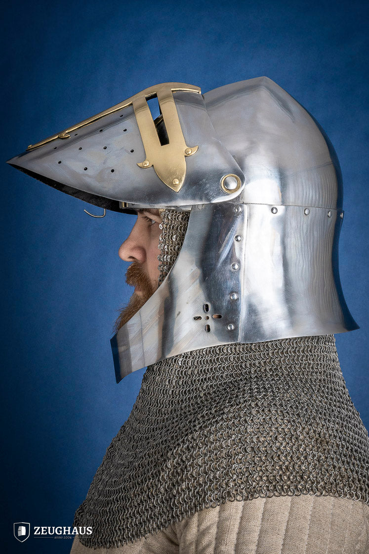 A detailed Sugar Loaf Helmet with a brass visor, showcasing its ornate cross design and steel craftsmanship, perfect for medieval reenactments.