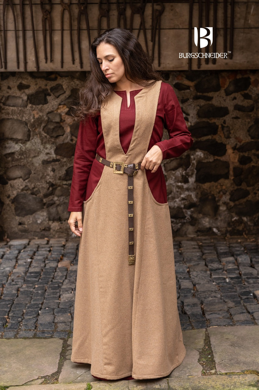 Ivrea Surcoat in Camel color, featuring a deep neckline and wide armholes, made from soft lightwool-flannel blend.