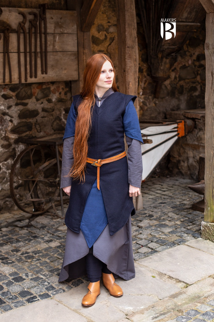 Tunic Meril Blue made of robust wool felt, featuring wide sleeve holes and elegant design, perfect for outdoor adventures.