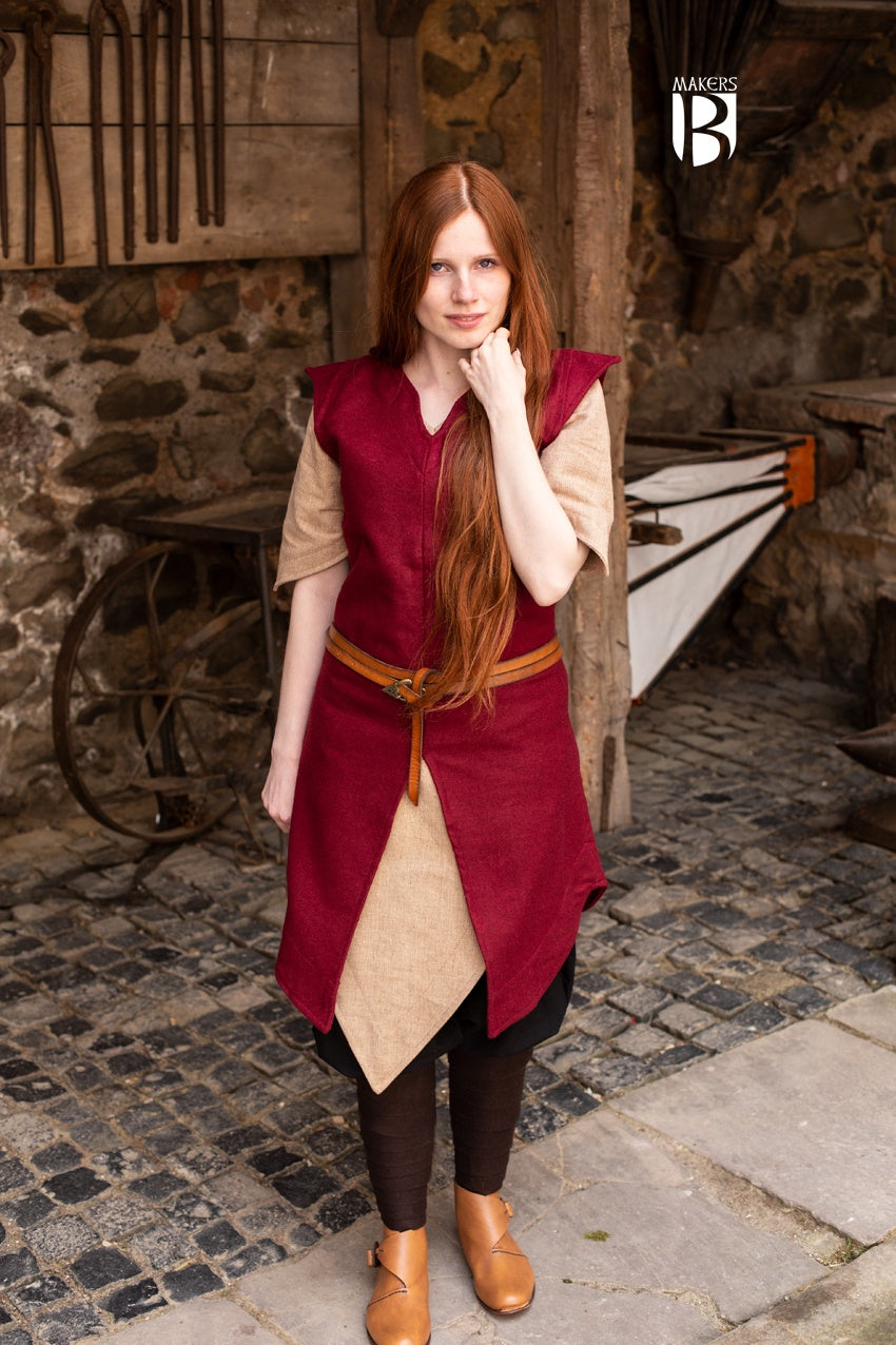 A vibrant red tunic made of robust wool felt, featuring wide sleeve holes and elegant slits for freedom of movement, perfect for adventurers.