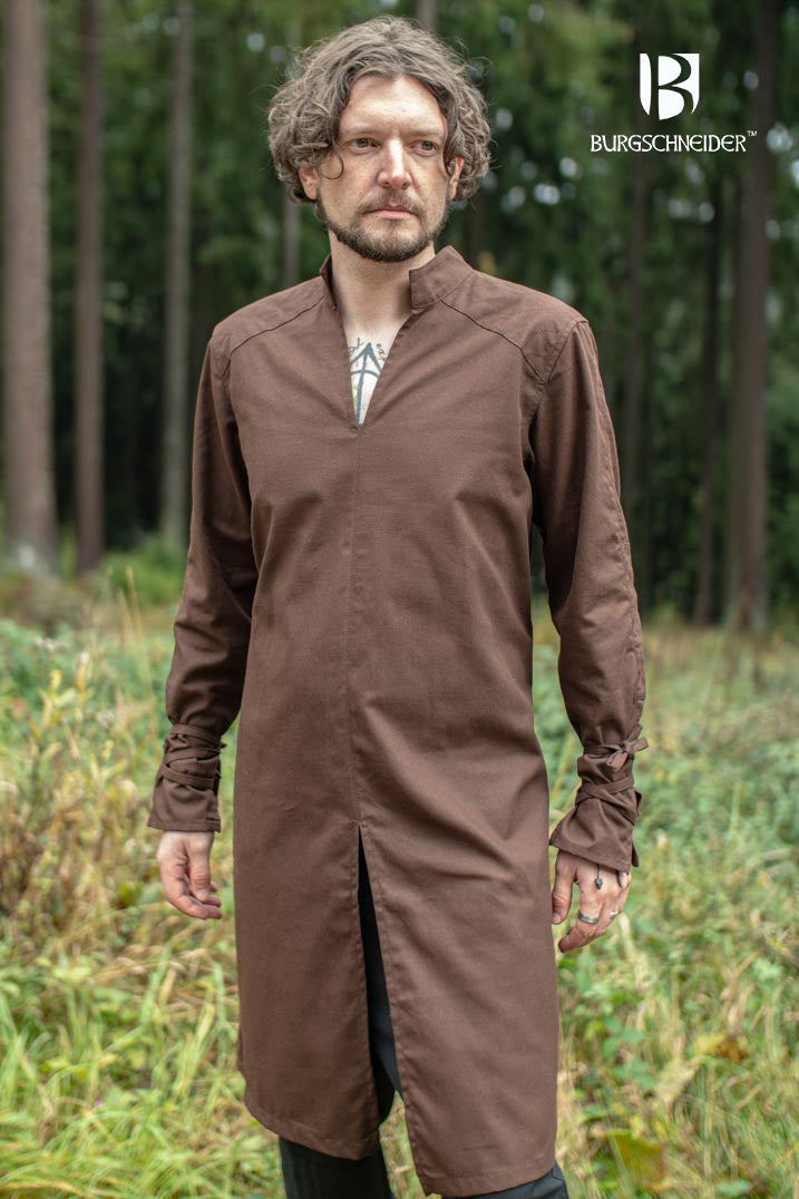 The Thereon Brown Tunic featuring long sleeves, quilted shoulders, and a v-shaped neckline, made from 100% cotton.