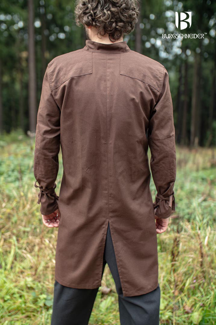 The Thereon Brown Tunic featuring long sleeves, quilted shoulders, and a v-shaped neckline, made from 100% cotton.