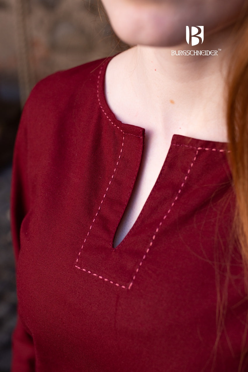 A medieval long-sleeved undergarment in rich bordeaux color, featuring decorative seams on the collar and sleeves, perfect for layering.