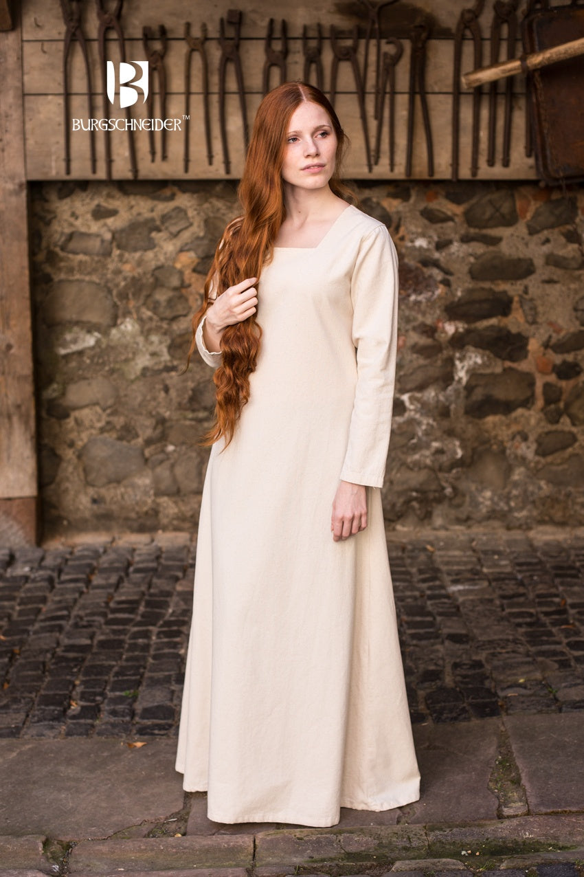 Under Dress Johanna Natural featuring a square neckline, long sleeves, and a robust cotton fabric with a linen look.