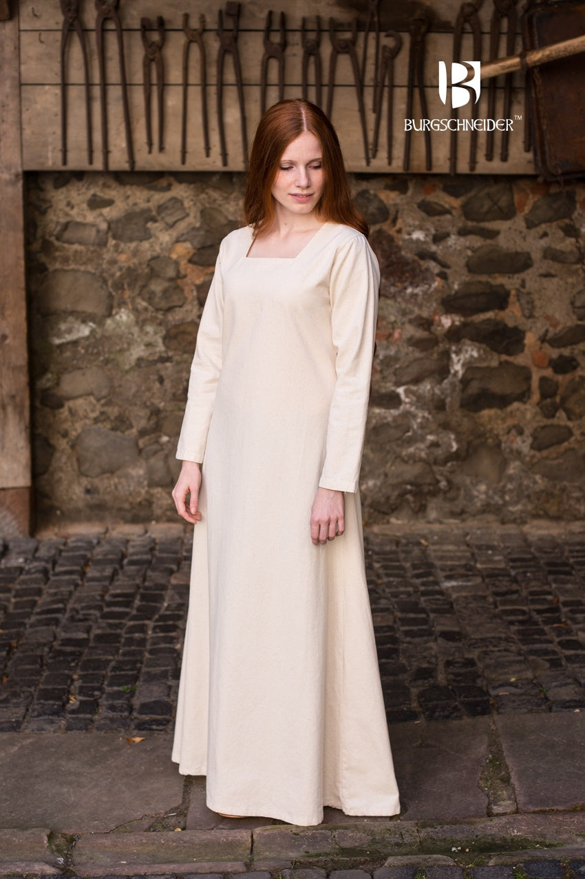 Under Dress Johanna Natural featuring a square neckline, long sleeves, and a robust cotton fabric with a linen look.