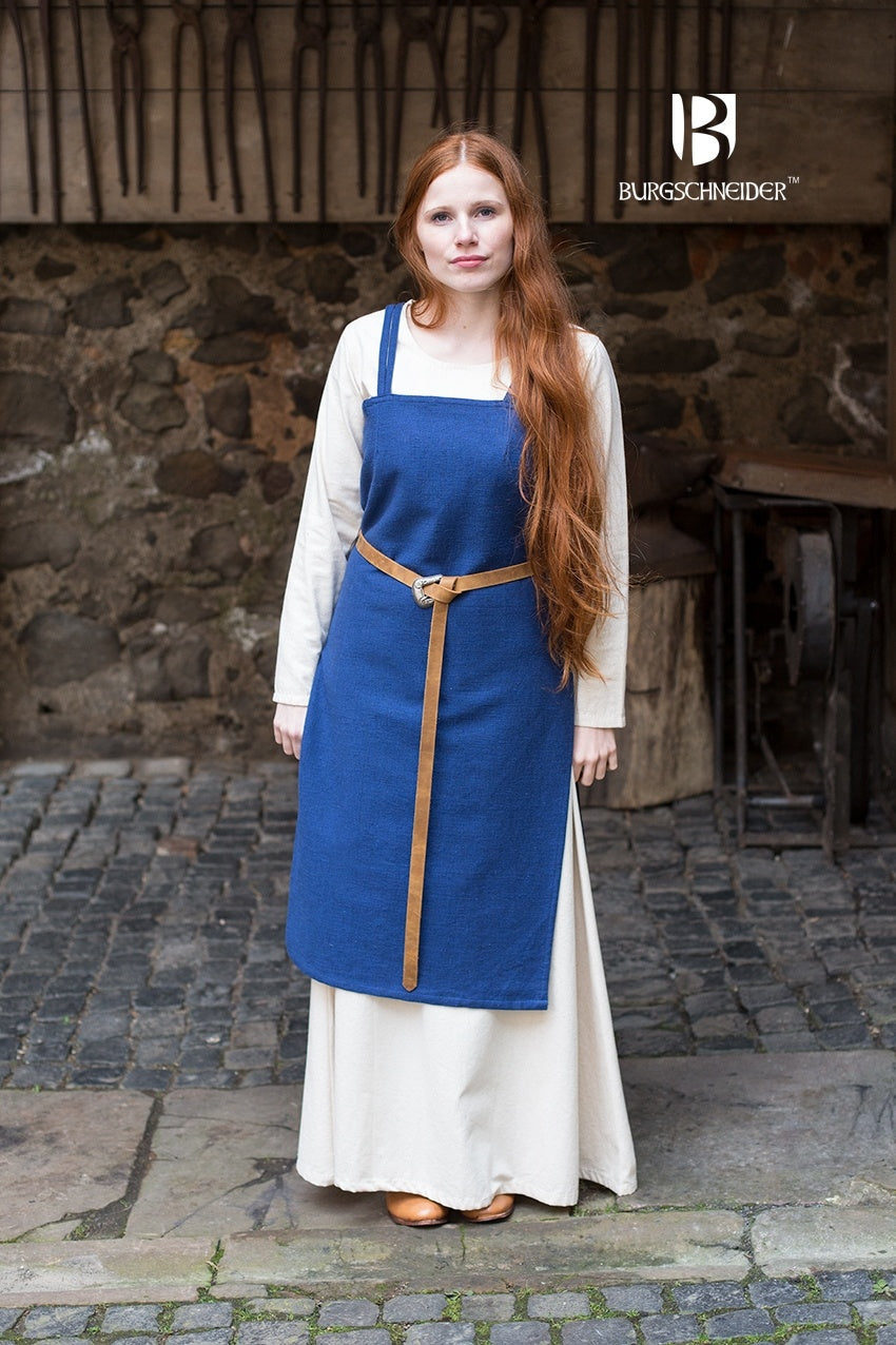 Viking Dress Frida Blue made of unkempt cotton, featuring a straight cut and side slits for movement, styled with matching accessories.