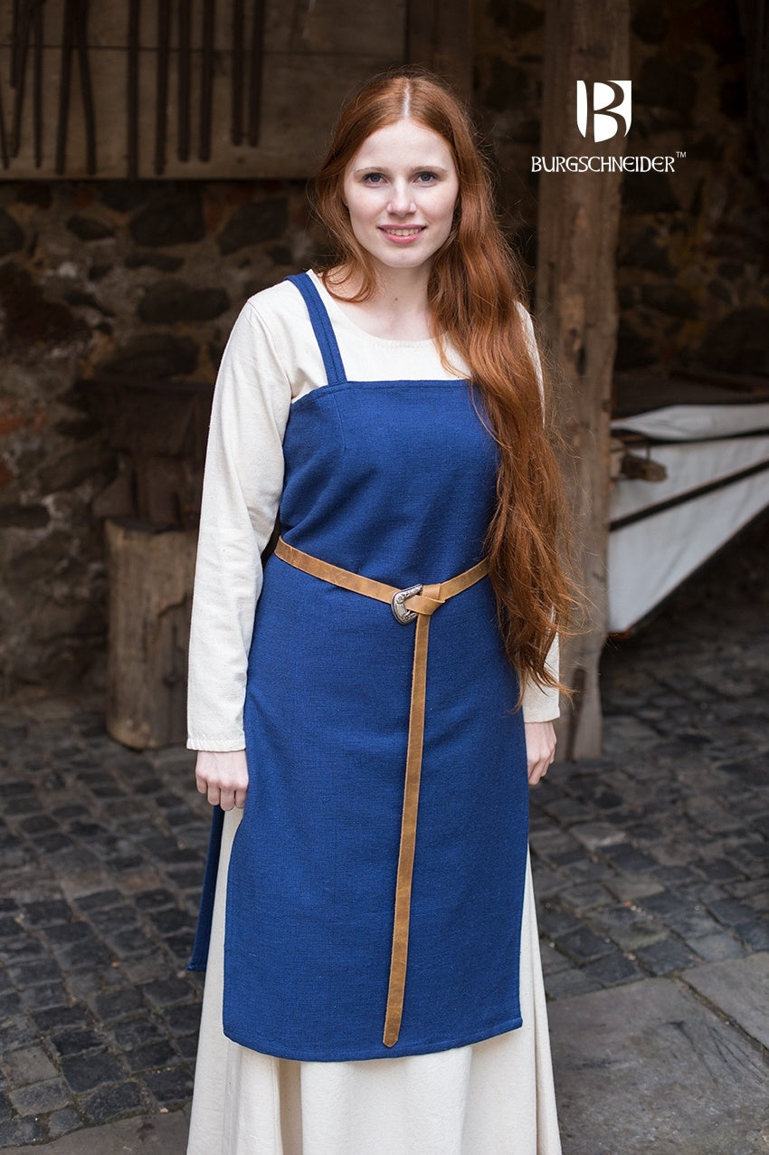 Viking Dress Frida Blue made of unkempt cotton, featuring a straight cut and side slits for movement, styled with matching accessories.