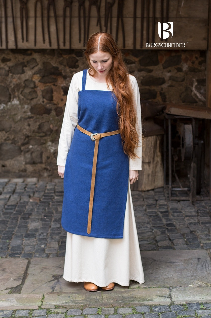 Viking Dress Frida Blue made of unkempt cotton, featuring a straight cut and side slits for movement, styled with matching accessories.