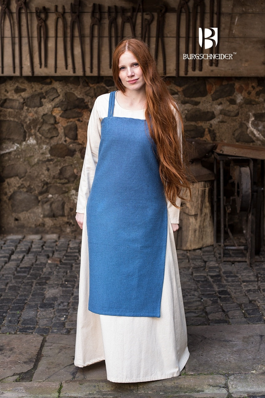 Viking Dress Frida in Ocean Blue, showcasing its coarse cotton texture and side slits for movement.