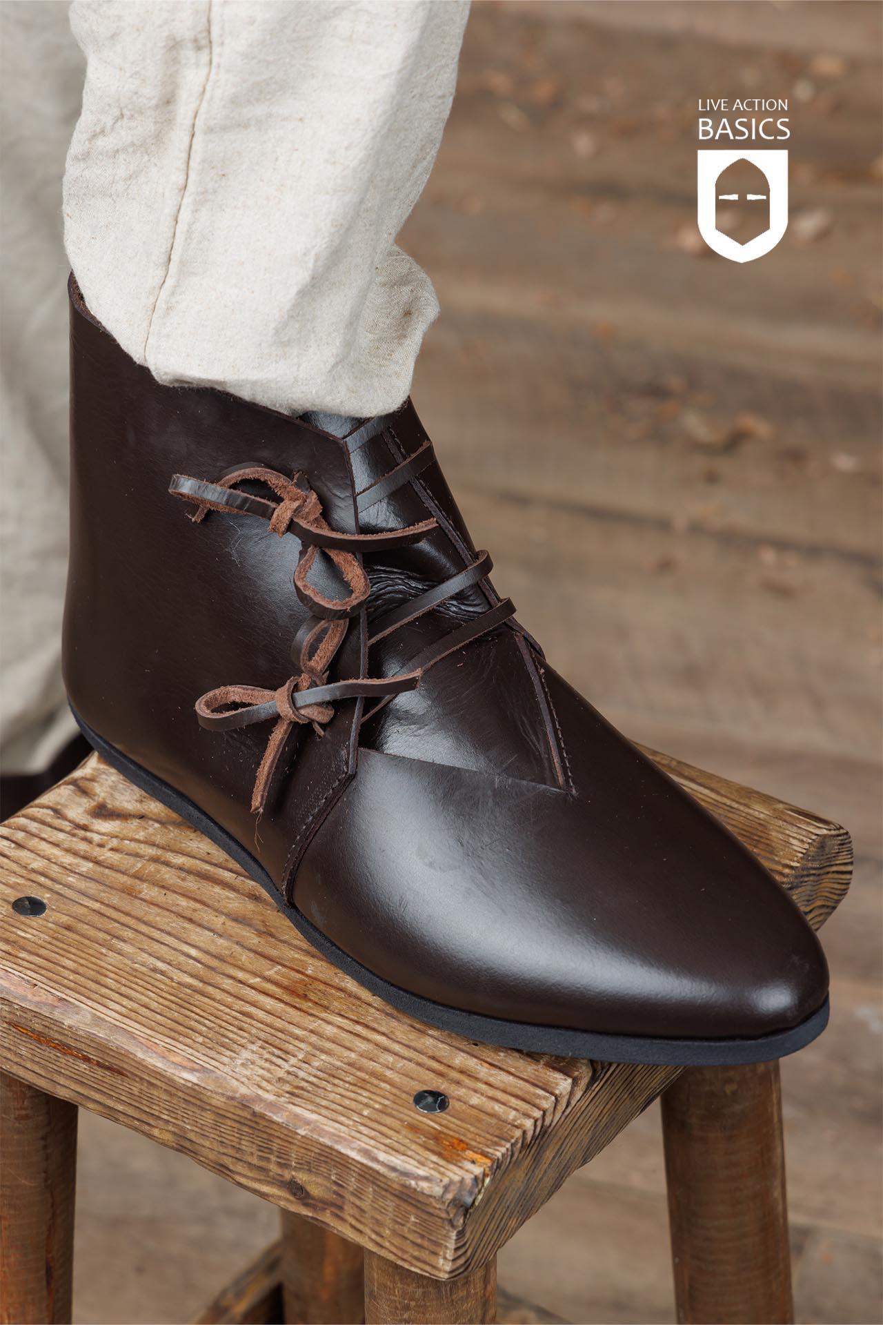 A pair of Viking Half Boots showcasing traditional craftsmanship with a sturdy rubber sole and front lacing, perfect for outdoor adventures.