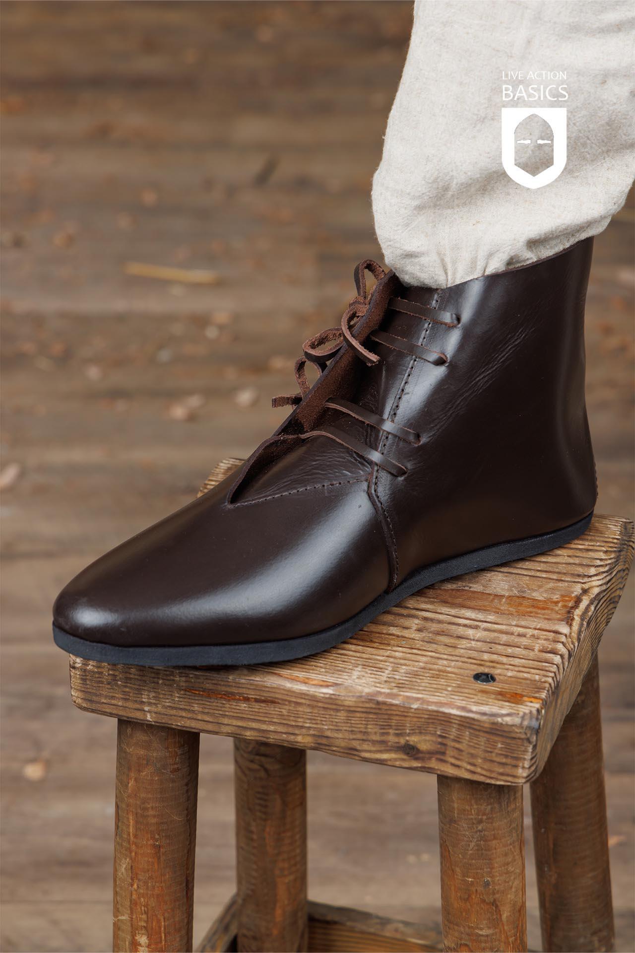 A pair of Viking Half Boots showcasing traditional craftsmanship with a sturdy rubber sole and front lacing, perfect for outdoor adventures.