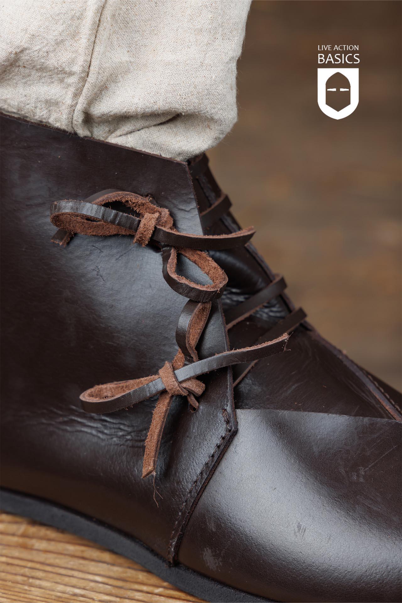A pair of Viking Half Boots showcasing traditional craftsmanship with a sturdy rubber sole and front lacing, perfect for outdoor adventures.