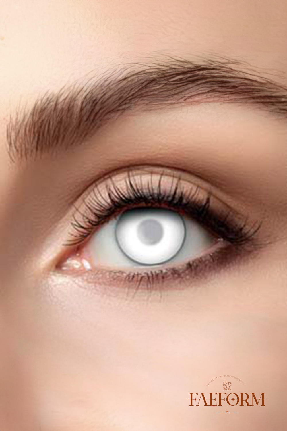 A pair of ethereal white Weekly Contact Lenses Ascension displayed in their packaging, showcasing their unique color and design.