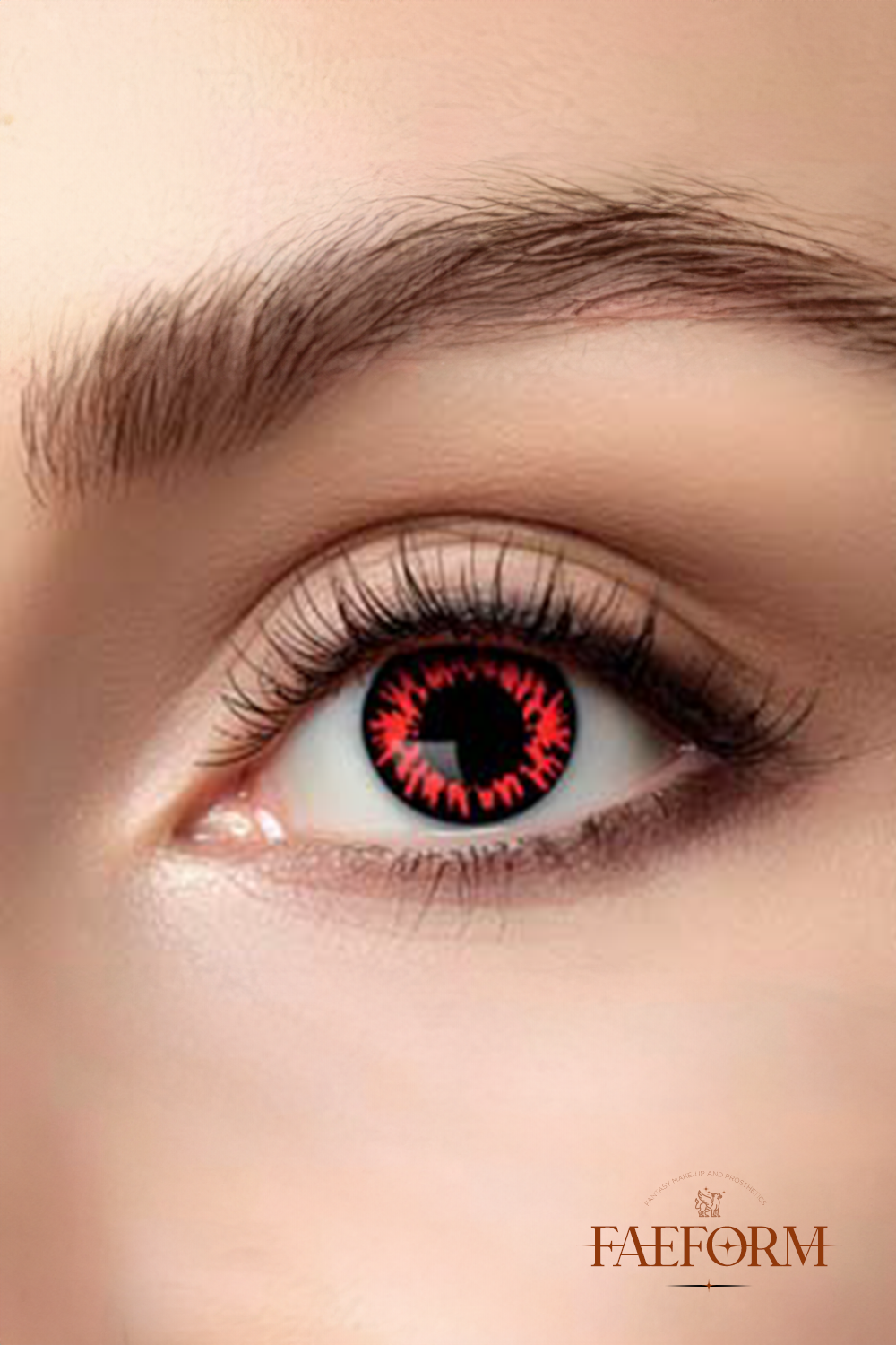 A pair of striking blood-red weekly contact lenses in their packaging, designed for dramatic character transformations.