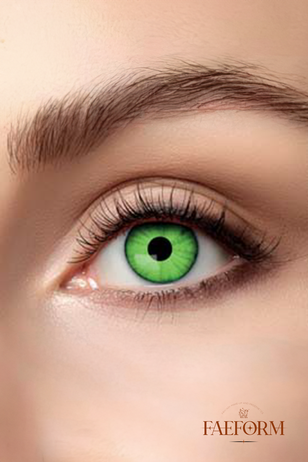 A pair of venomous green weekly contact lenses in liquid, showcasing their vibrant color and packaging.