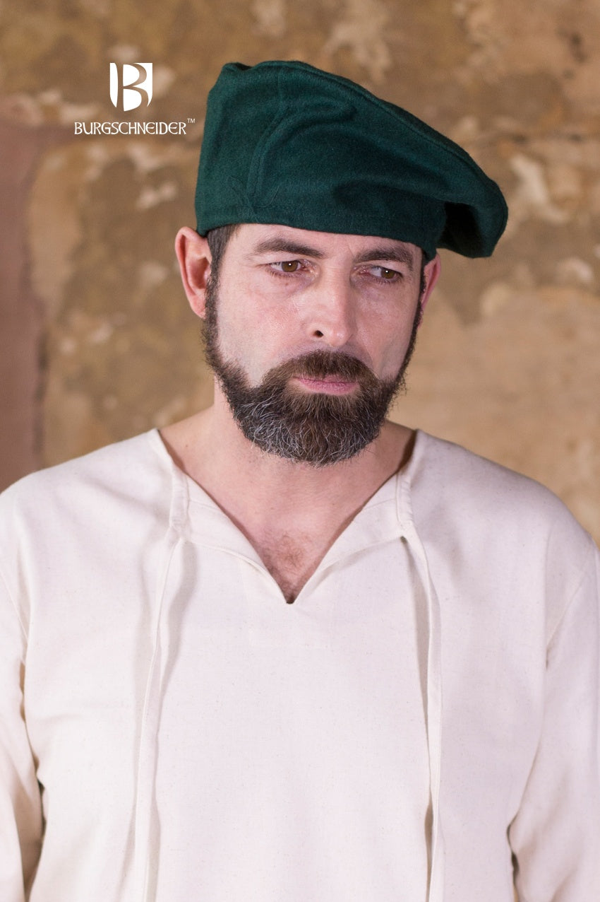 A stylish green wool beret, showcasing its classic design and soft texture, perfect for costumes and everyday wear.