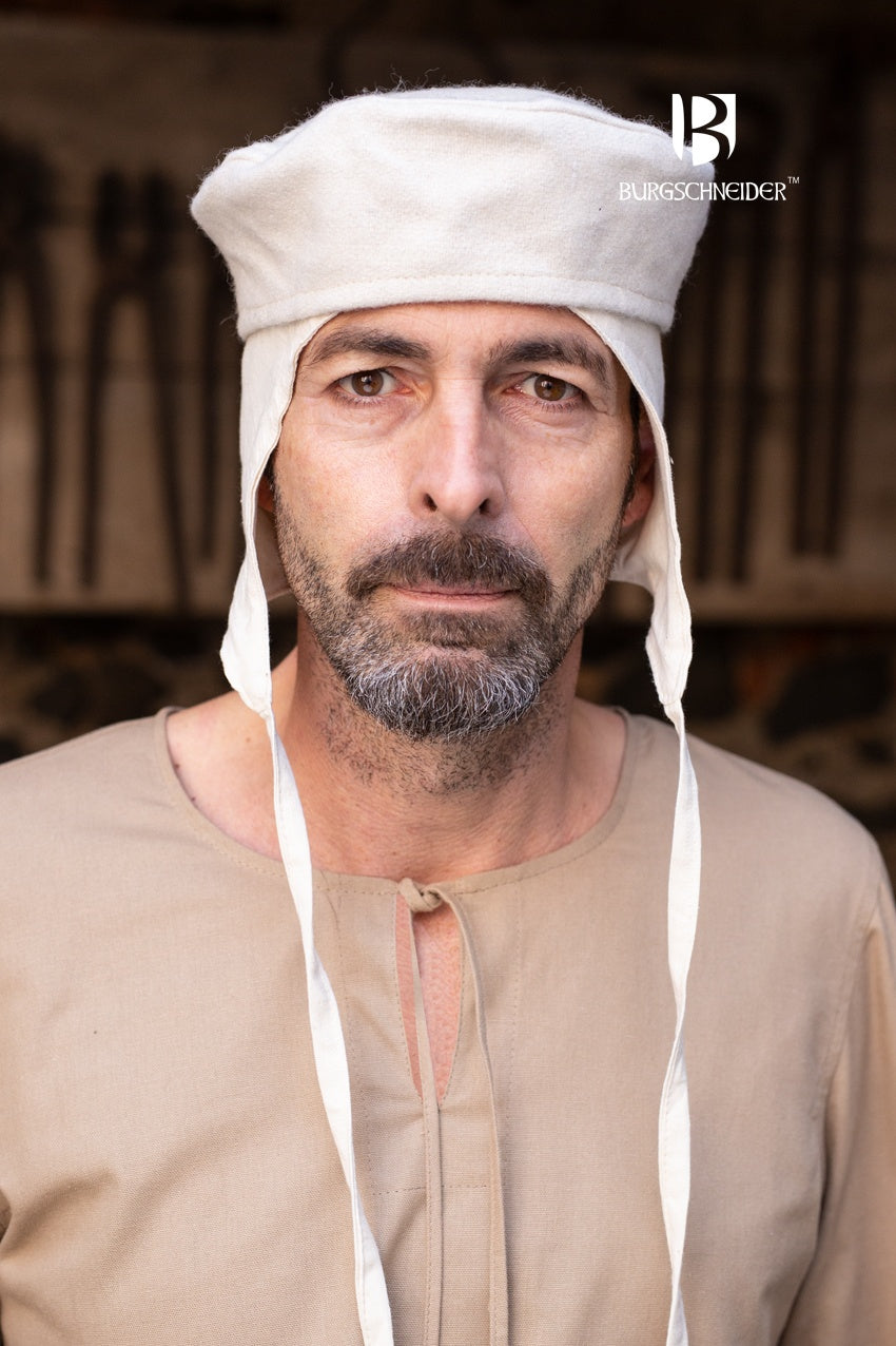 Wool Cap Hugo Natural, a round medieval cap made of durable wool felt, featuring a flat top and natural color, perfect for costumes.