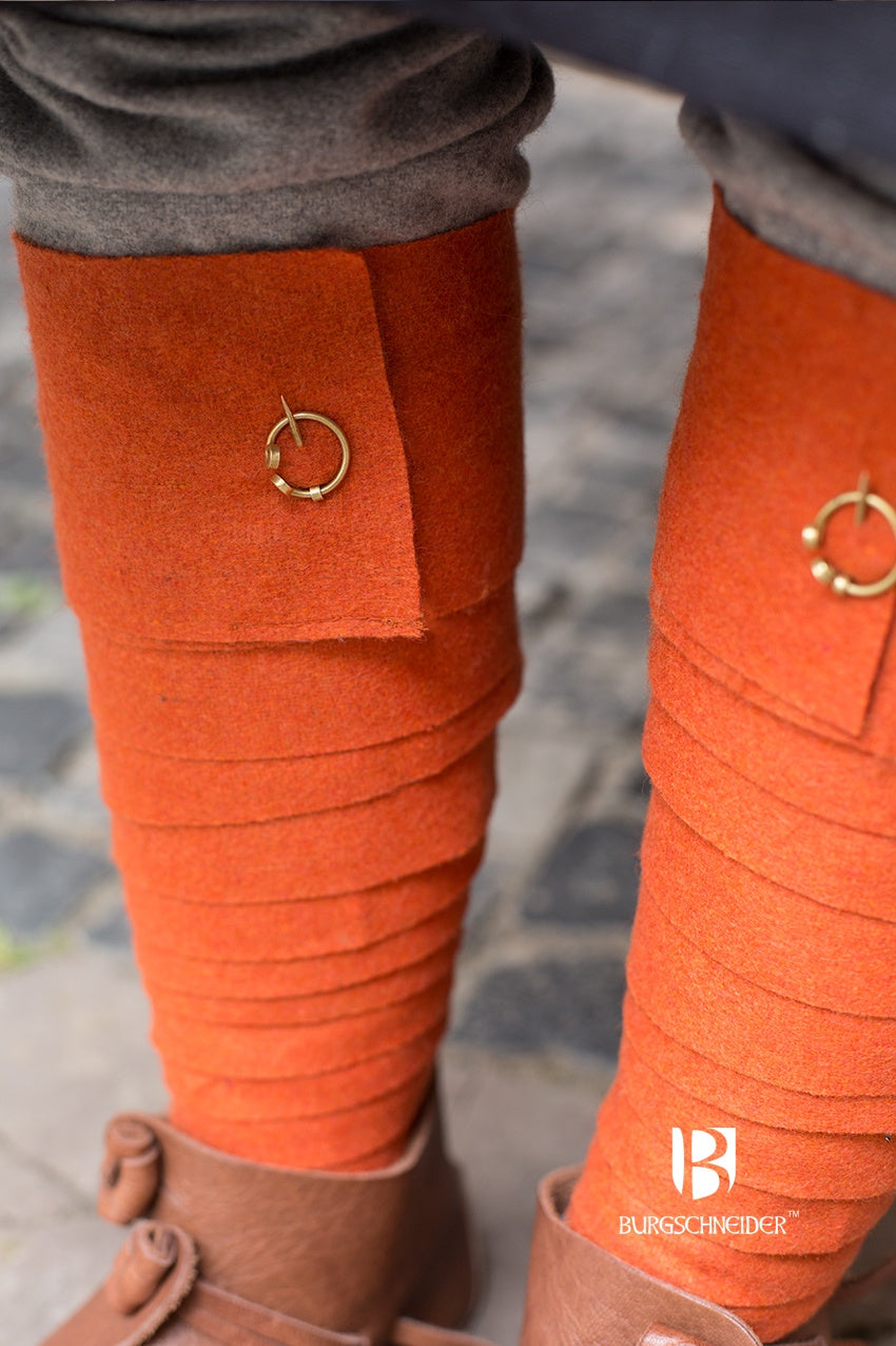 A pair of vibrant orange Wool Winingas Aki, showcasing their traditional design and high-quality wool material, perfect for warmth and historical reenactments.