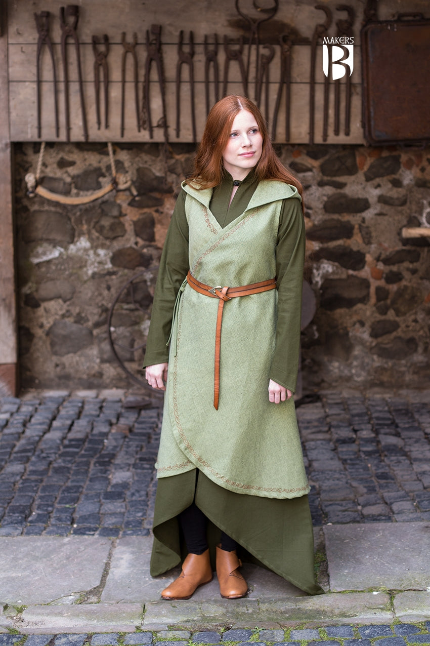 Wrap Dress Dala in Linden Green featuring ornamental embroidery, V-neckline, and long hood, showcasing its flowing design.