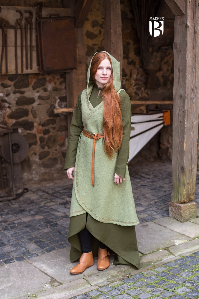 Wrap Dress Dala in Linden Green featuring ornamental embroidery, V-neckline, and long hood, showcasing its flowing design.