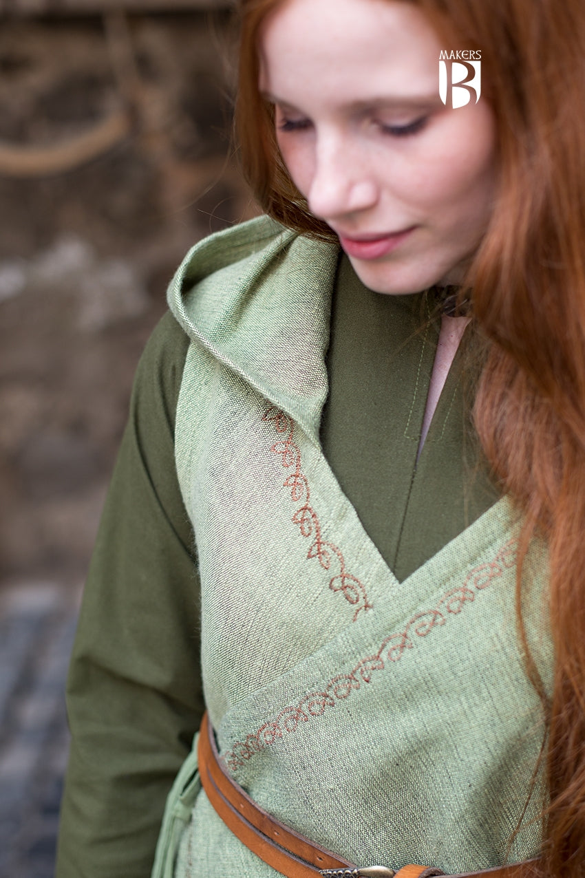 Wrap Dress Dala in Linden Green featuring ornamental embroidery, V-neckline, and long hood, showcasing its flowing design.