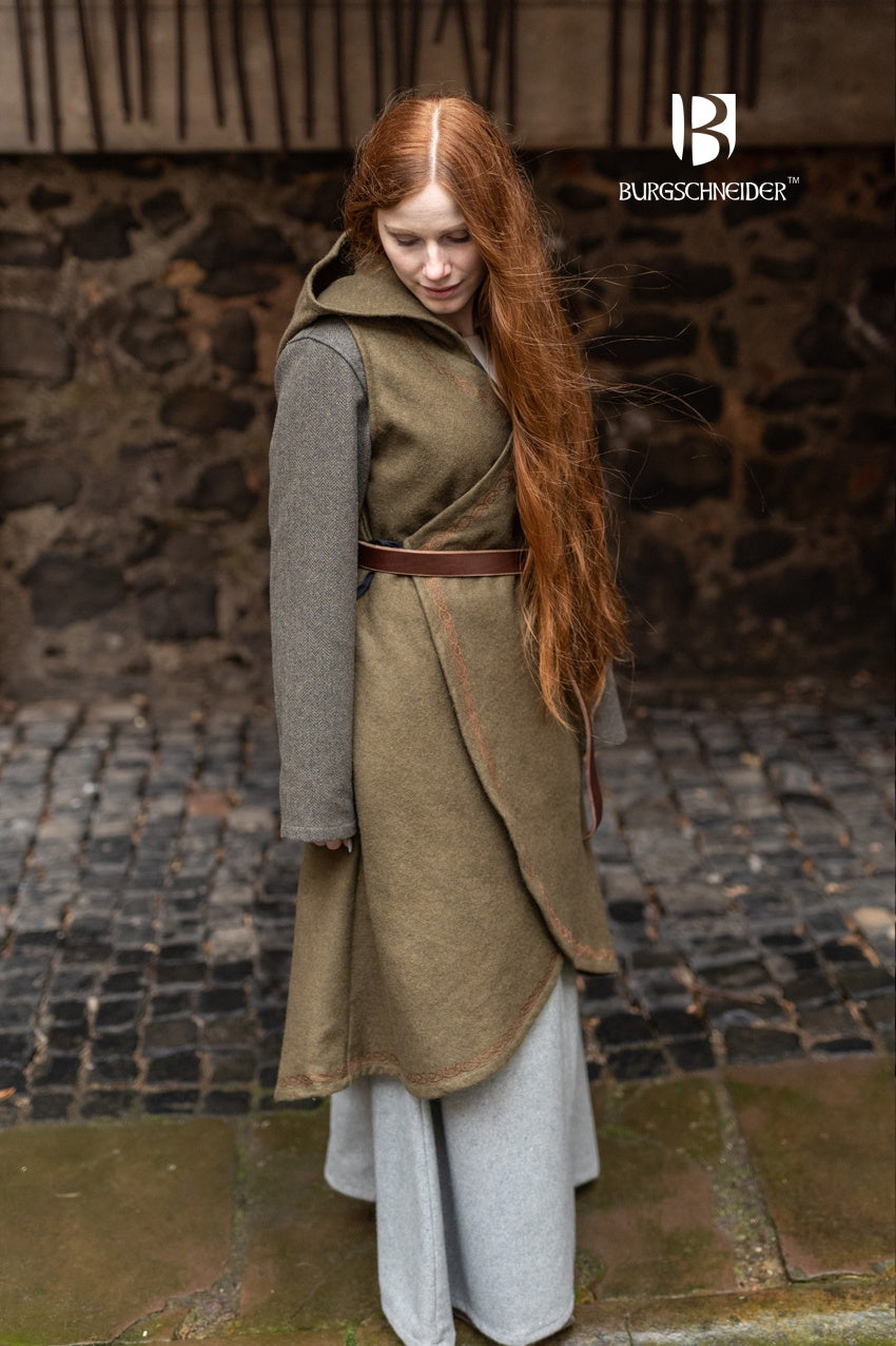 Wrap Dress Myrana in Autumn Green featuring a V-neckline, long hood, and ornamental embroidery, made from warm wool felt.