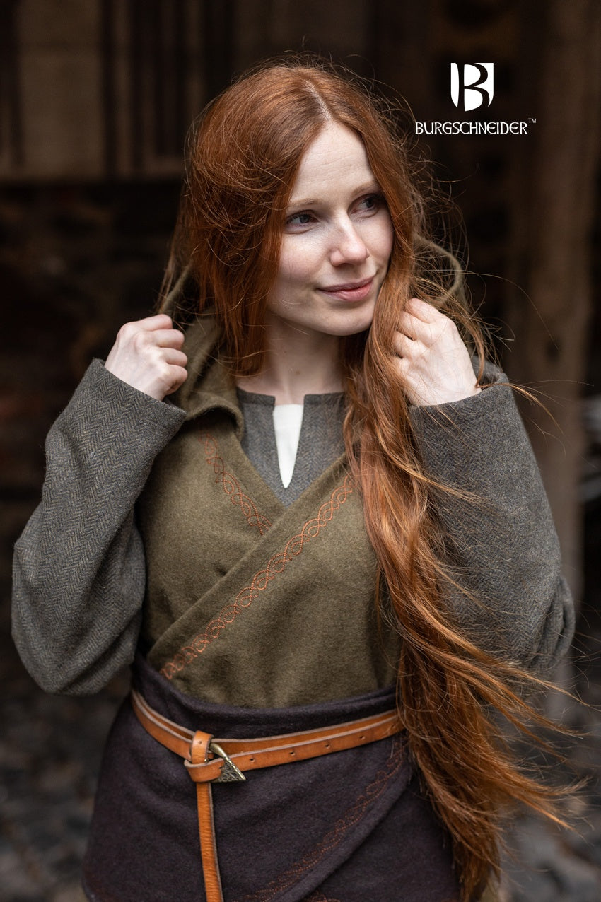 Wrap Dress Myrana in Autumn Green featuring a V-neckline, long hood, and ornamental embroidery, made from warm wool felt.