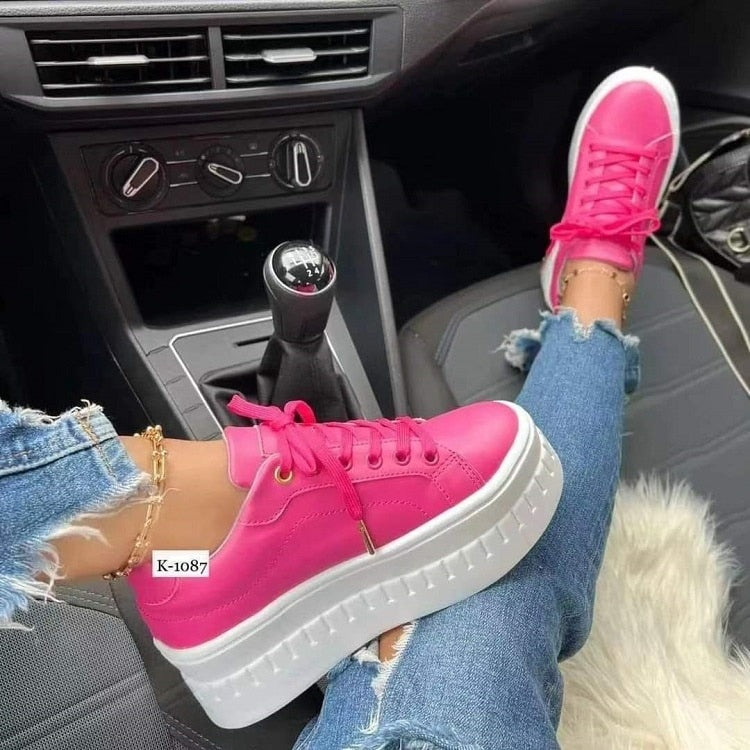 A pair of stylish Casual Platform Women's Shoes in a trendy design, showcasing their flat sole and breathable material, perfect for casual wear.