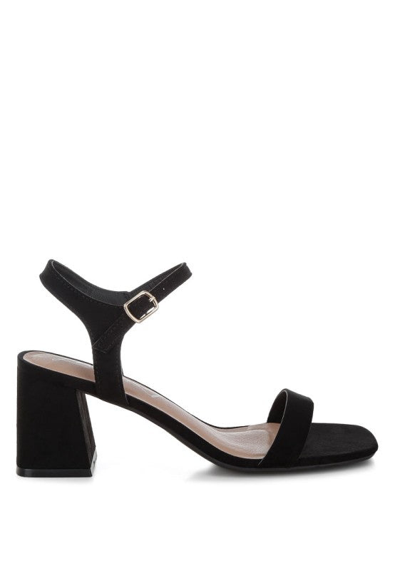 Akiya Square Toe Block Heels featuring a flared block heel, open square toe, and pin buckle fastening in recycled microfiber.