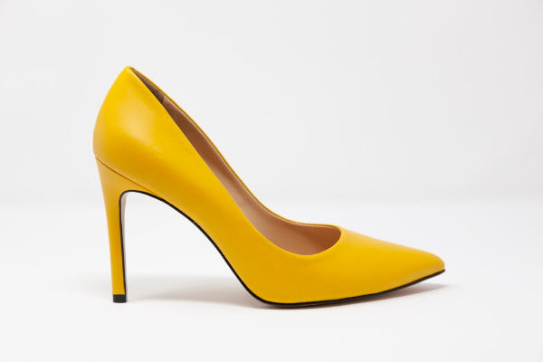 Kendi Pointed-Toe Leather Pumps showcasing a sleek design with a 3.4-inch covered heel, crafted from high-quality leather.