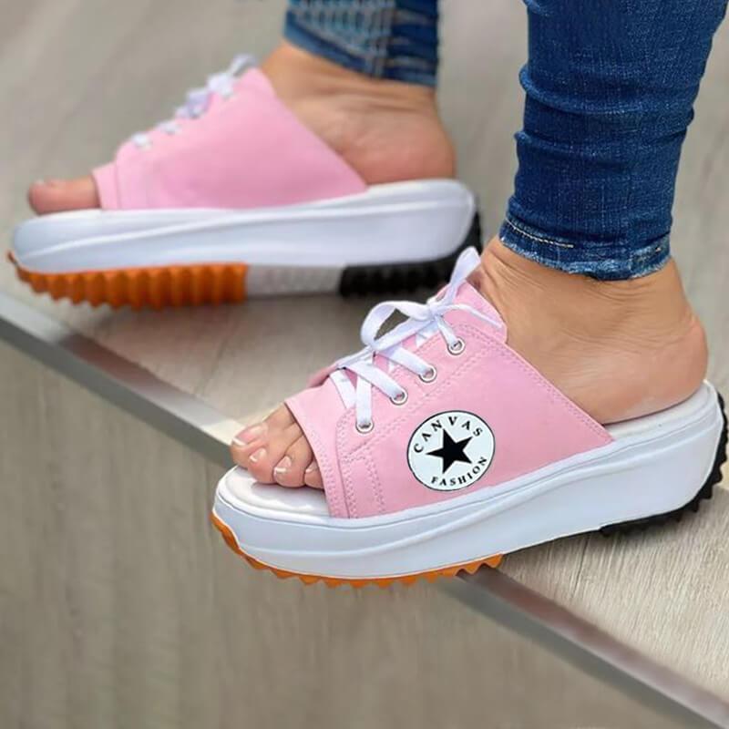 A pair of 2022 Casual Canvas Thick-soled Lace-up Women's Sandals in a stylish design, showcasing their thick sole and lace-up feature.