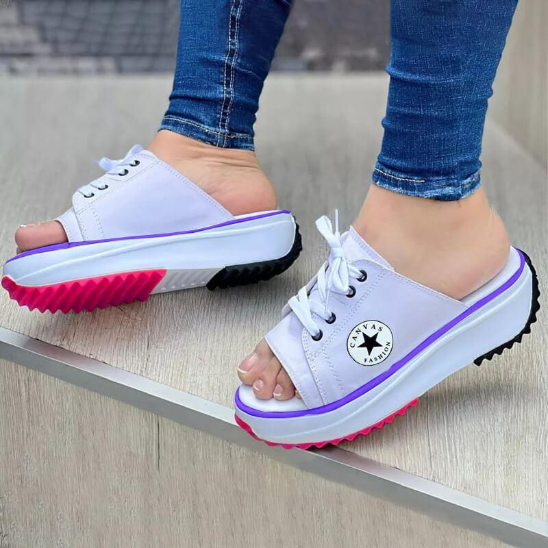 A pair of 2022 Casual Canvas Thick-soled Lace-up Women's Sandals in a stylish design, showcasing their thick sole and lace-up feature.