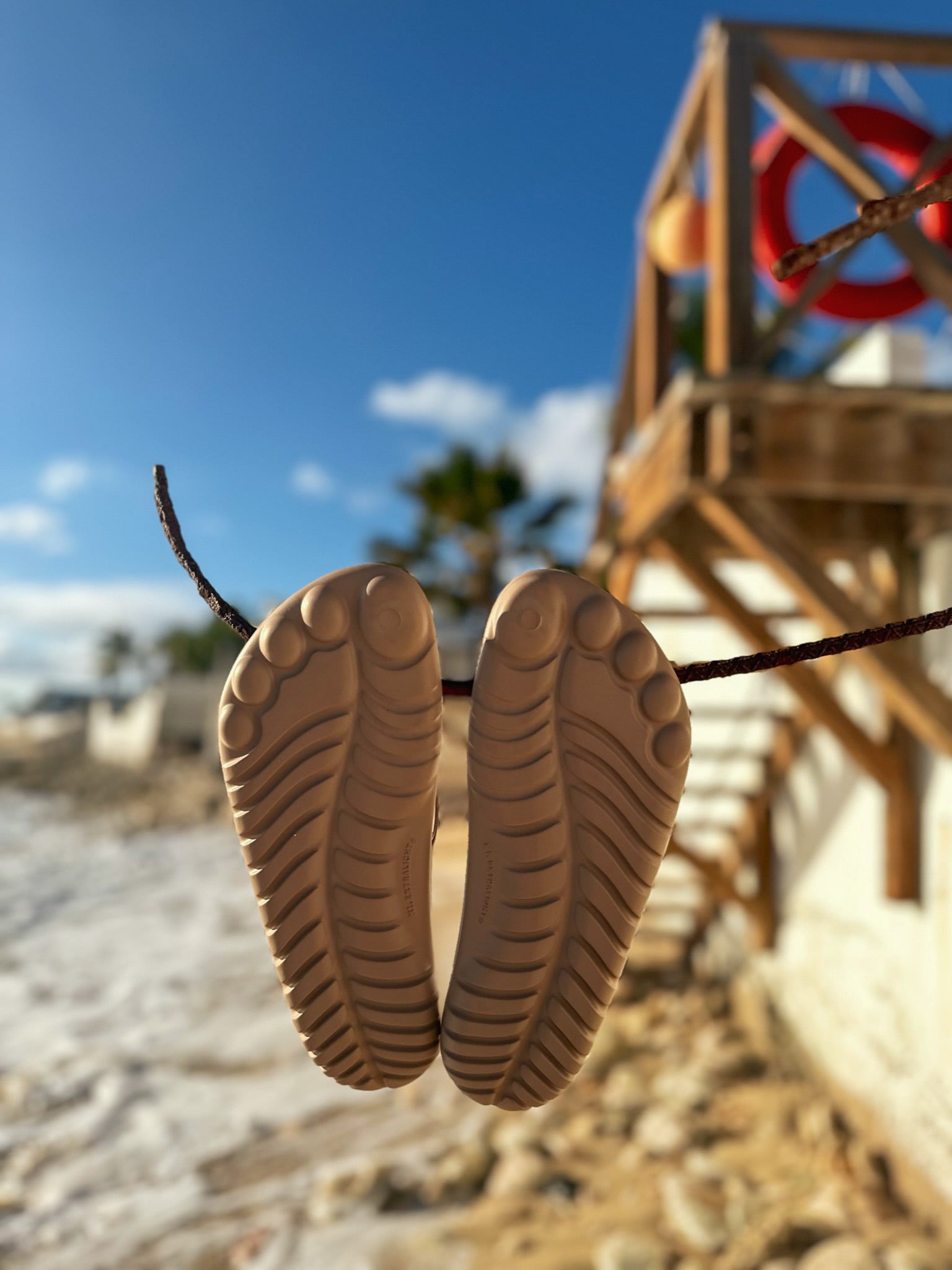 A pair of stylish Beach Nude Flip-Flops showcasing a minimalist design, perfect for beach and casual wear.