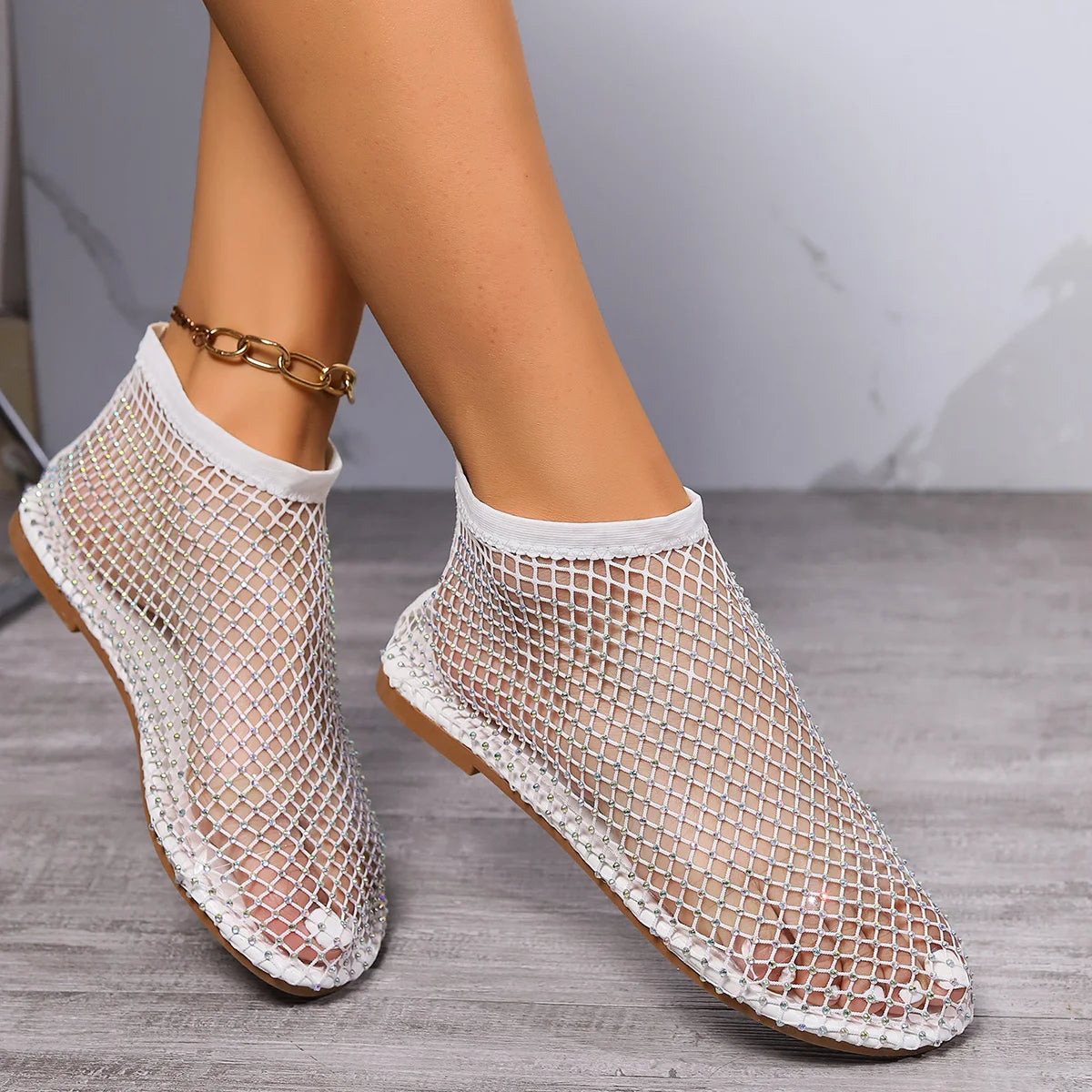 Luxury round toe flat bottom sandals with breathable mesh upper and durable rubber sole, perfect for summer casual wear.