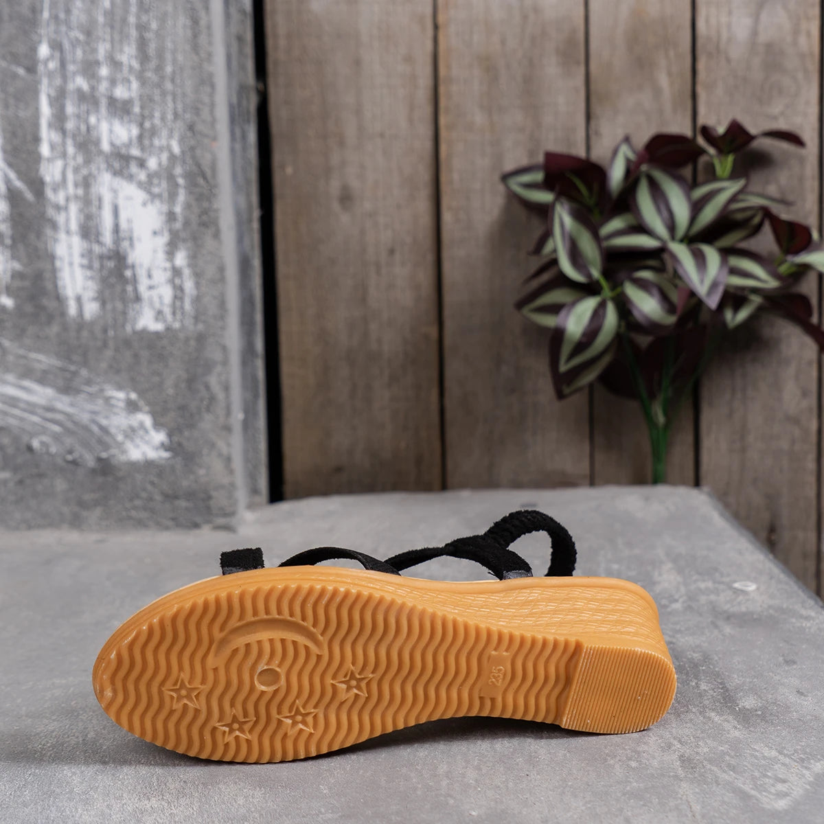 Stylish women's wedge sandals in solid color with ankle buckle and cork outsole, perfect for casual wear.