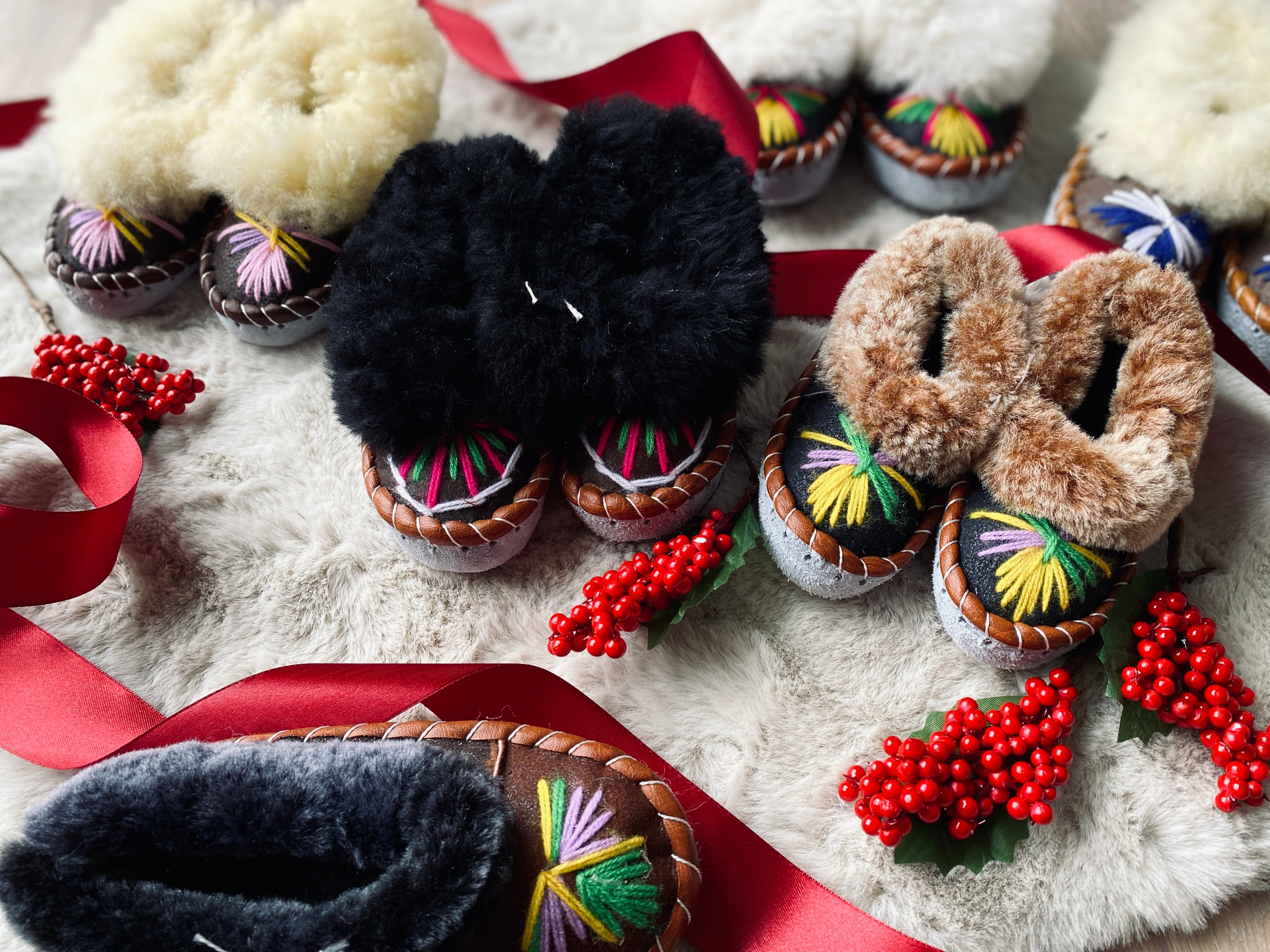 Colorful children's embroidered sheepskin slippers with fluffy fur cuff, handmade in Poland.