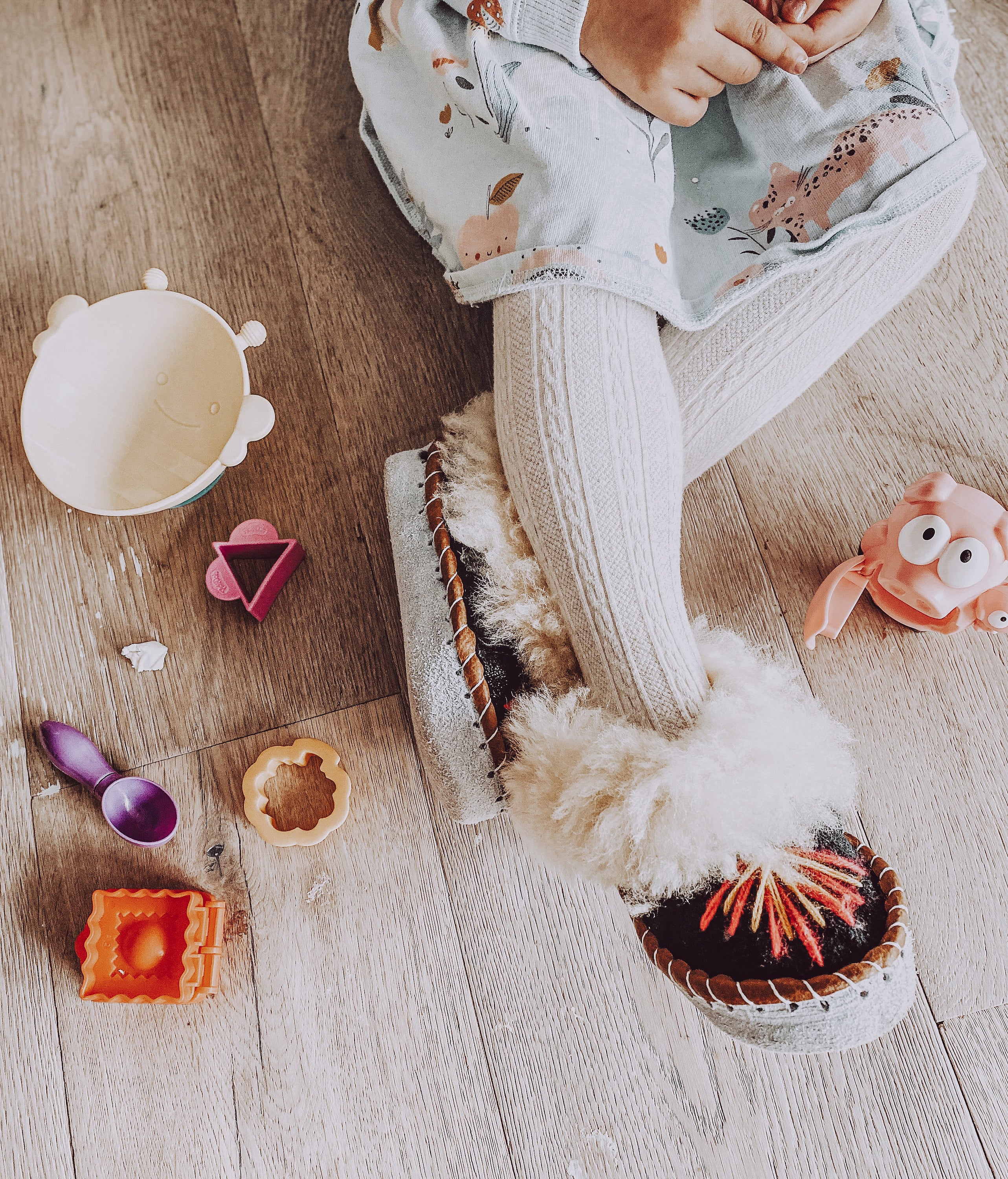 Colorful children's embroidered sheepskin slippers with fluffy fur cuff, handmade in Poland.