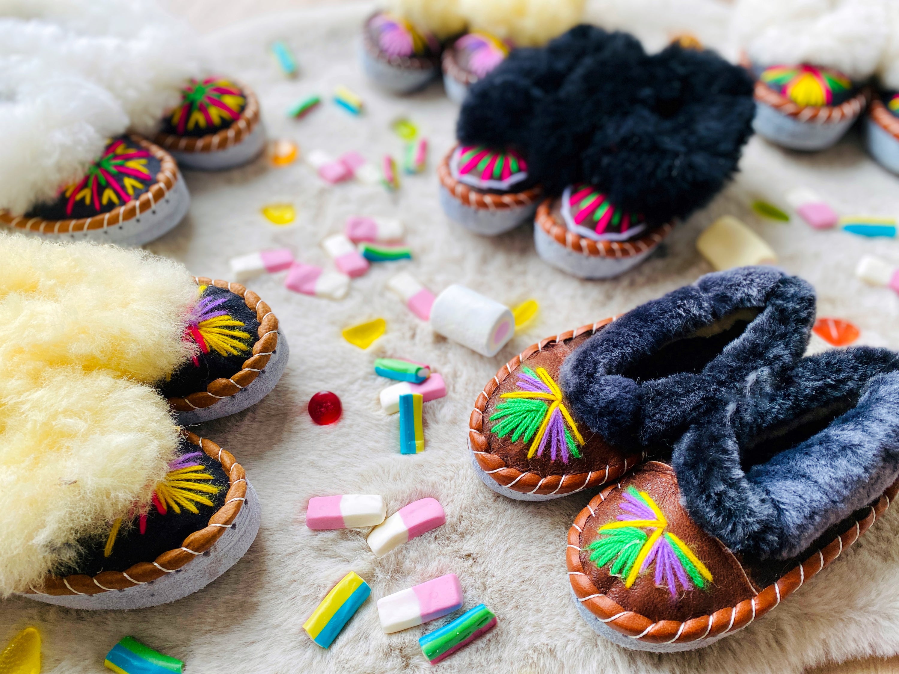Colorful children's embroidered sheepskin slippers with fluffy fur cuff, handmade in Poland.