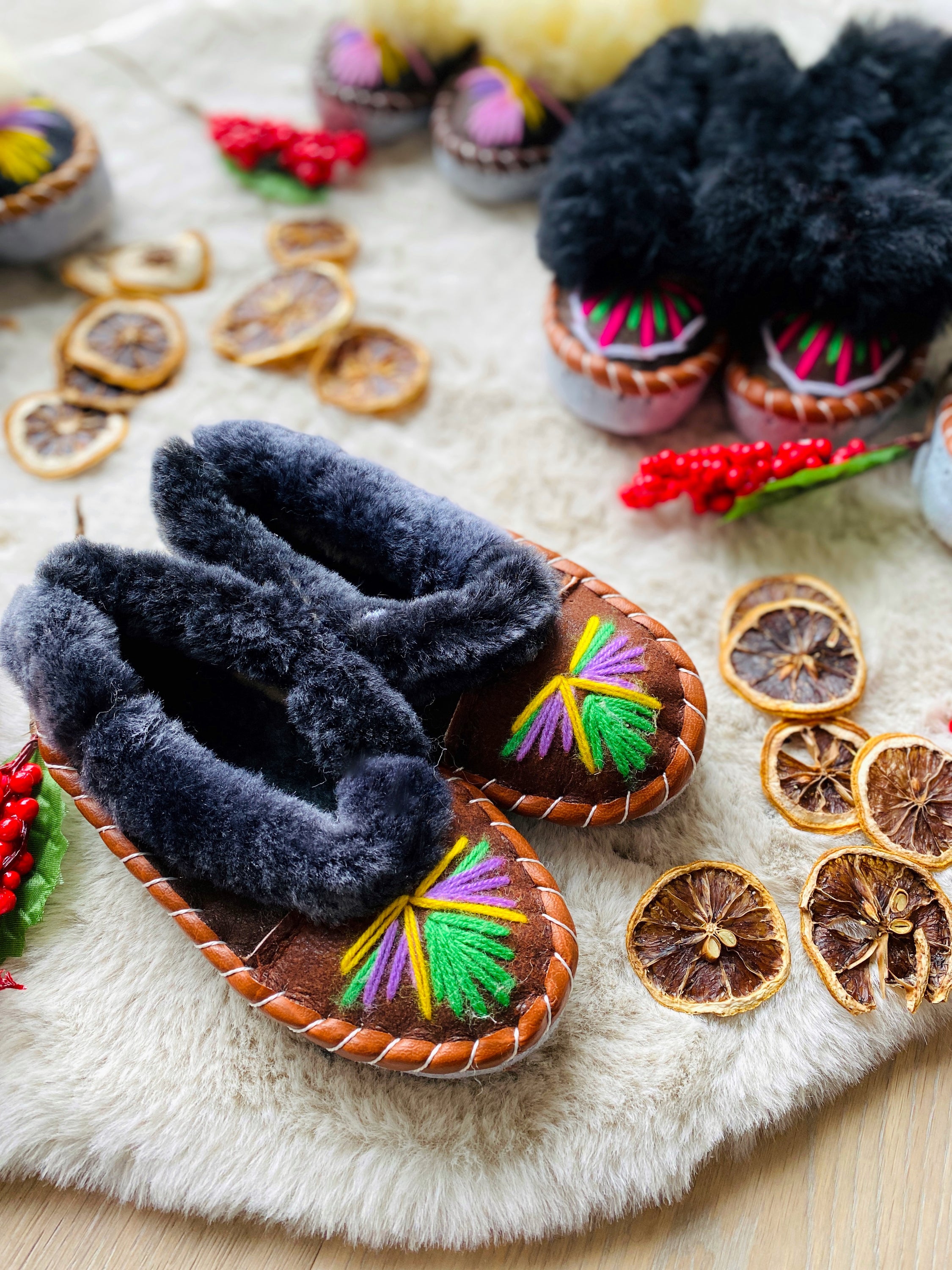 Colorful children's embroidered sheepskin slippers with fluffy fur cuff, handmade in Poland.