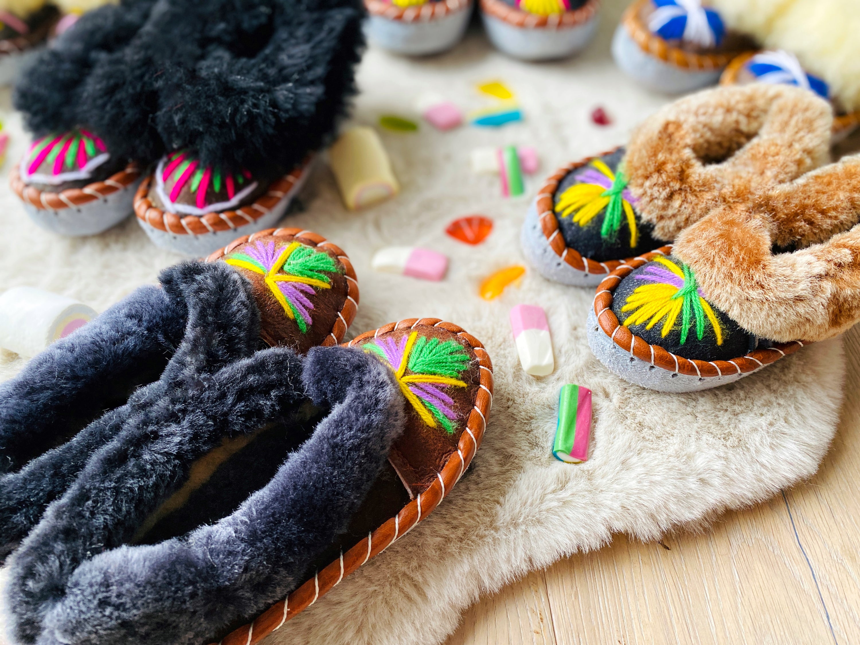 Colorful children's embroidered sheepskin slippers with fluffy fur cuff, handmade in Poland.