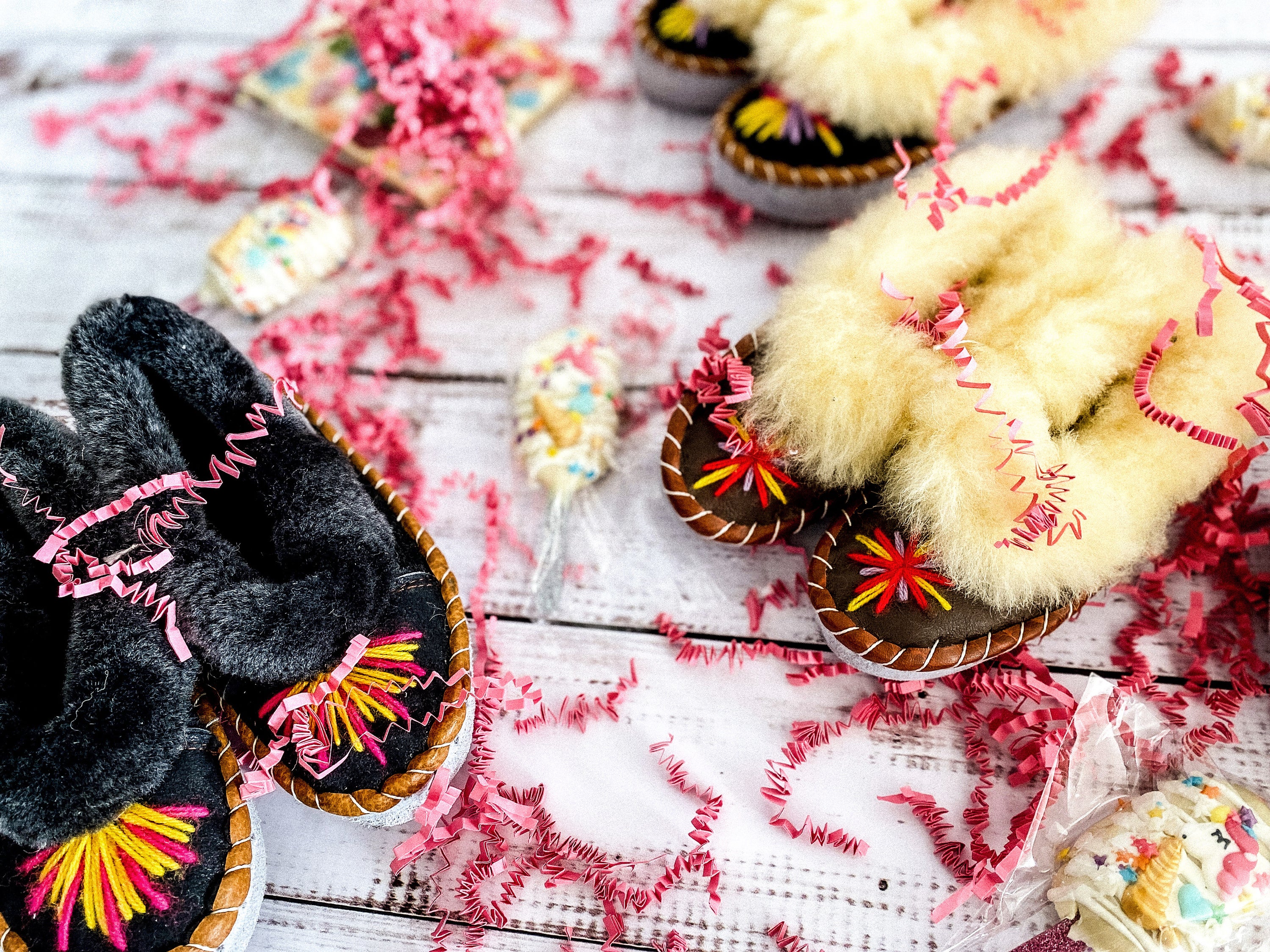 Colorful children's embroidered sheepskin slippers with fluffy fur cuff, handmade in Poland.