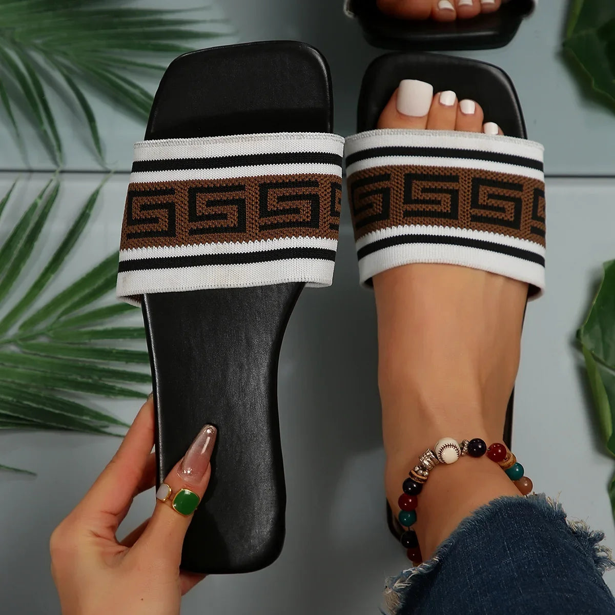 A pair of stylish Designer style casual slippers from Sexikinis Swim, featuring a flat platform design and a solid pattern, perfect for summer outings.