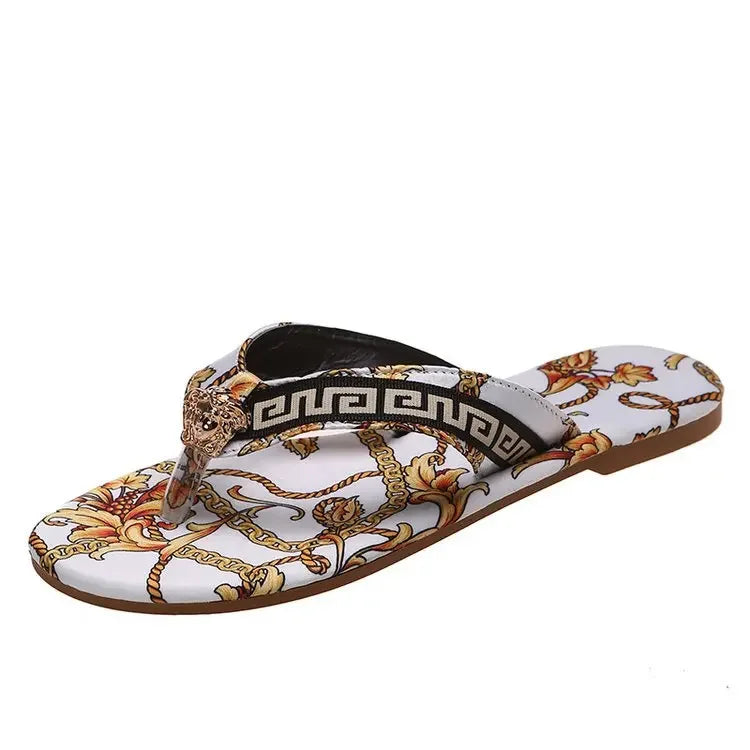 A pair of stylish Designer slippers from the sexikinis swim collection featuring vibrant prints, perfect for summer lounging and beach outings.
