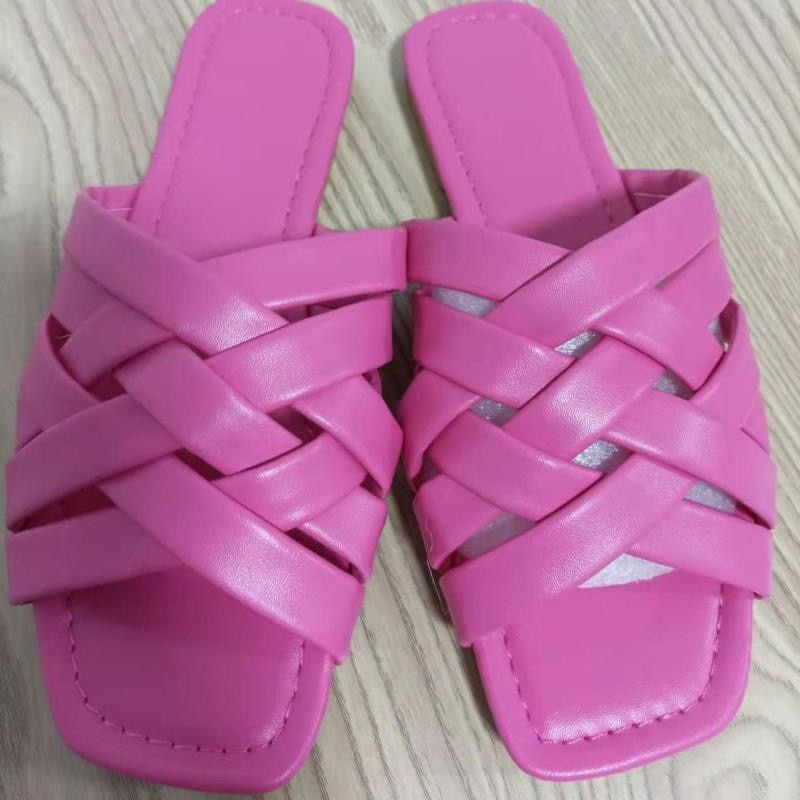 A pair of stylish summer leather flat beach slides for women, showcasing a casual design suitable for outdoor wear.