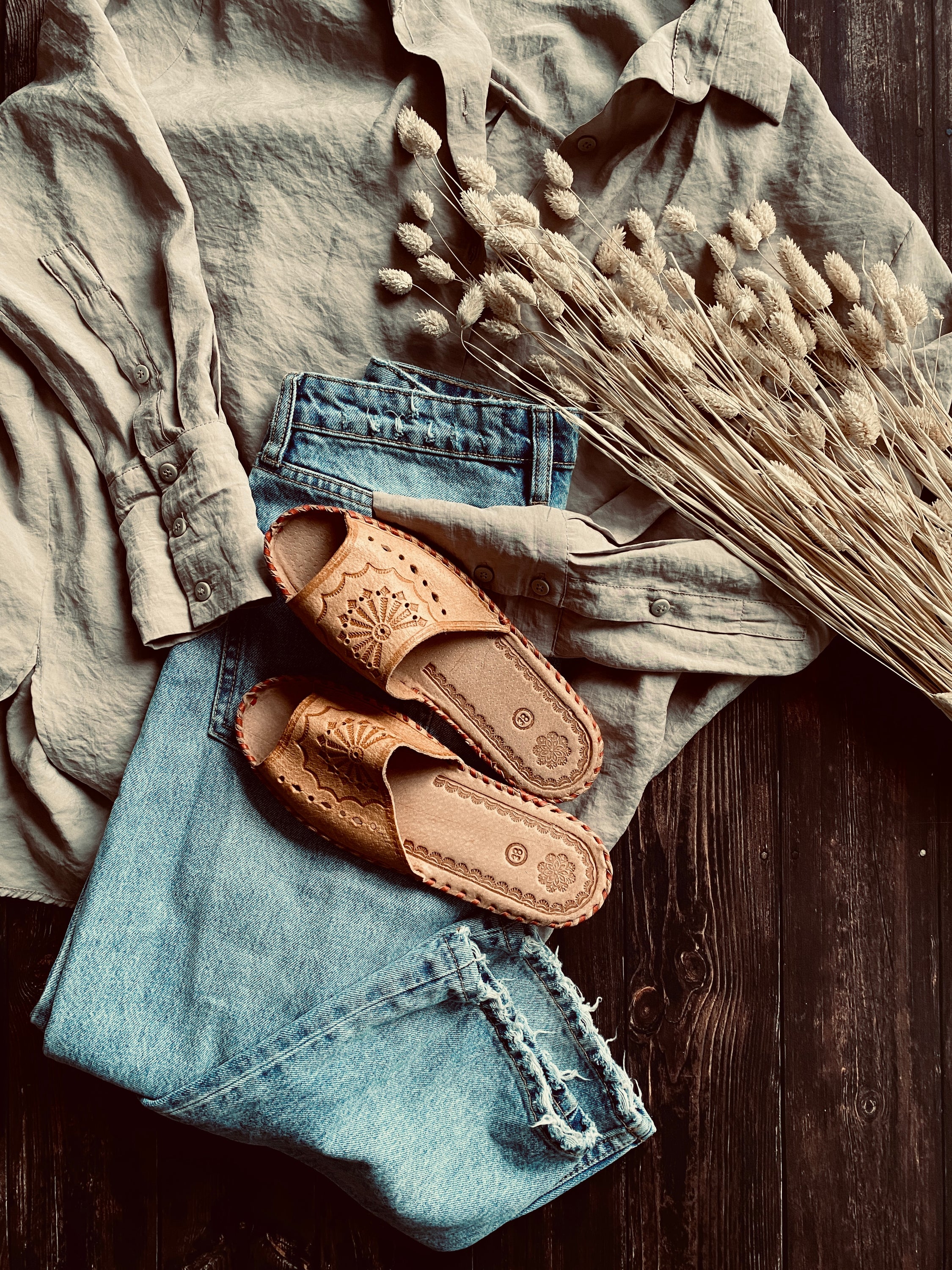 Wanderlust Open Toe Slippers featuring handmade leather with boho embroidery, perfect for warm weather wear.