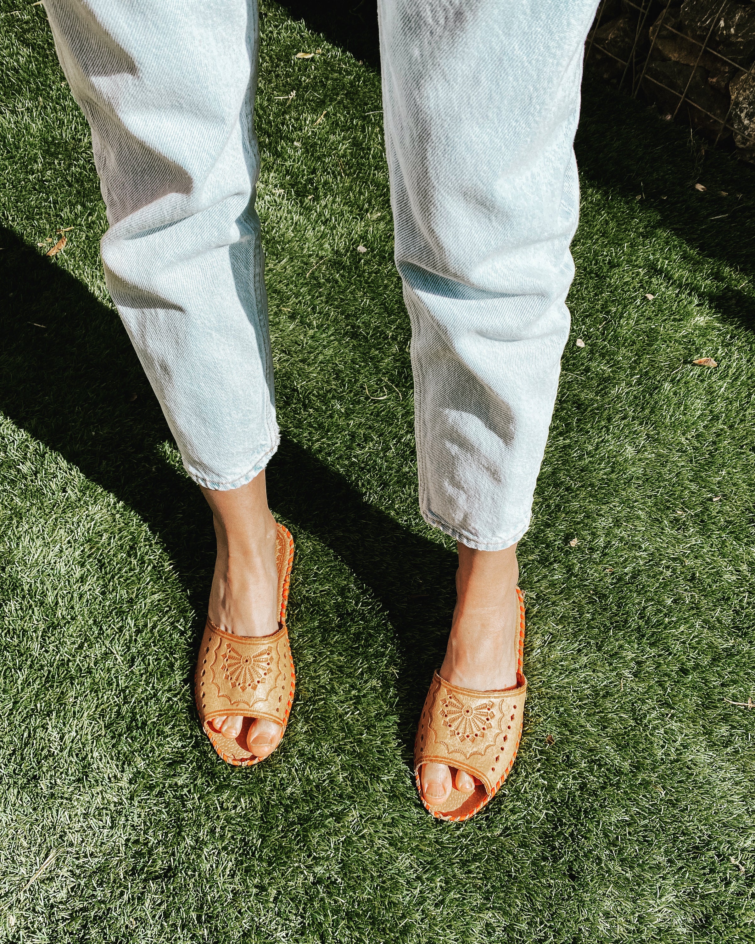 Wanderlust Open Toe Slippers featuring handmade leather with boho embroidery, perfect for warm weather wear.
